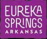 Logo for Eureka Springs, Arkansas, featuring stylized text on a purple background.